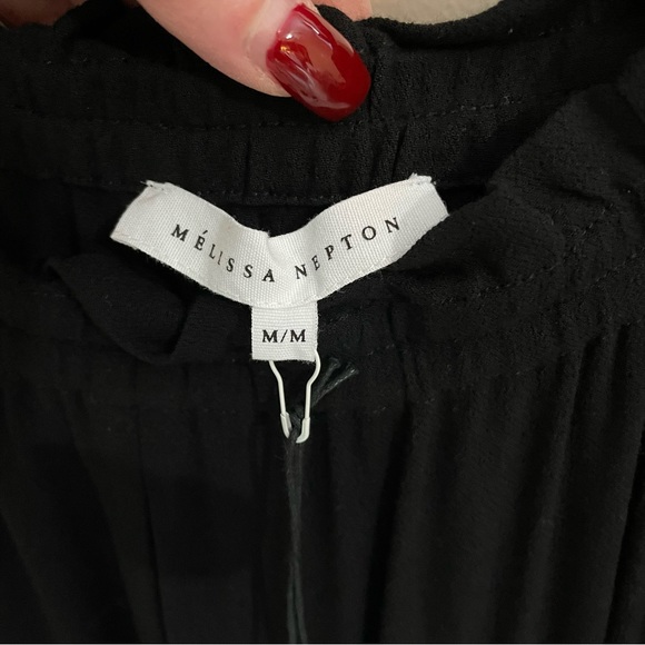 Melissa Nepton black off shoulder jumpsuit with flutter sleeves and tulip legs. - Picture 3 of 9